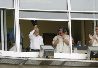 DETROIT - JULY 21:  Hall of Fame broadcaster, Ernie Harwell tips his cap as he receives a standing ovation from the crowd in this, his last season at Comerica Park in Detroit, Michigan on July 21, 2002.  The Twins dfeated the Tigers 4-2.  (Photo by Tom Pidgeon/Getty Images)
