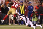 SAN FRANCISCO - AUGUST 14:  Michael Spurlock #18 of the San Francisco 49ers is tackled by Tony Carter #37 of the Denver Broncos during a preseason game on August 14, 2009 at Candlestick Park in San Francisco, California.  (Photo by Jed Jacobsohn/Getty Images)
