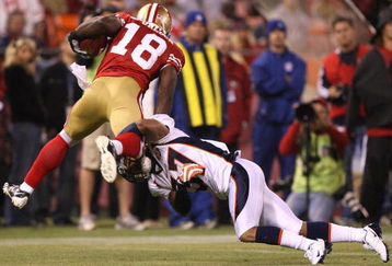 SAN FRANCISCO - AUGUST 14:  Michael Spurlock #18 of the San Francisco 49ers is tackled by Tony Carter #37 of the Denver Broncos during a preseason game on August 14, 2009 at Candlestick Park in San Francisco, California.  (Photo by Jed Jacobsohn/Getty Images)
