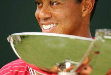 ATLANTA - SEPTEMBER 16:  Tiger Woods holds the FedEx Cup trophy after winning the TOUR Championship, the final event of the new PGA TOUR Playoffs for the FedExCup at East Lake Golf Club on September 16, 2007 in Atlanta, Georgia.  (Photo by Streeter Lecka/Getty Images)
