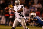 SAN DIEGO - DECEMBER 04:  Quarterback JaMarcus Russell #2 of the Oakland Raiders is grabbed by Linebacker Shaun Philips #95 of the San Diego Chargers during their NFL Game on December 4, 2008 at Qualcomm Stadium in San Diego, California.  (Photo by Harry How/Getty Images)