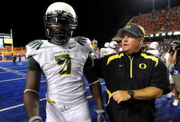 BOISE, ID - SEPTEMBER 3:  LaGarrette Blount #9 of the Oregon Ducks is escorted off the field by head coach Chip Kelly after Blount punched a Boise State Broncos player on September 3, 2009 at Bronco Stadium in Boise, Idaho. Boise State defeated Oregon 19-8.  (Photo by Steve Dykes/Getty Images)