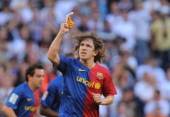 MADRID, SPAIN - MAY 02: Carles Puyol of Barcelona celebrates after scoring his team's third goal during the La Liga match between Real Madrid and Barcelona at the Santiago Bernabeu stadium on May 2, 2009 in Madrid, Spain. (Photo by Denis Doyle/Getty Images)