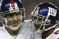 GLENDALE, AZ - FEBRUARY 03:  (R-L) David Tyree #85 and Eli Manning #10 of the New York Giants celebrate after Manning threw a 5-yard touchdown to Tyree in the fourth quarter against the New England Patriots during Super Bowl XLII on February 3, 2008 at the University of Phoenix Stadium in Glendale, Arizona.  (Photo by Elsa/Getty Images)