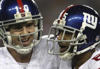 GLENDALE, AZ - FEBRUARY 03:  (R-L) David Tyree #85 and Eli Manning #10 of the New York Giants celebrate after Manning threw a 5-yard touchdown to Tyree in the fourth quarter against the New England Patriots during Super Bowl XLII on February 3, 2008 at the University of Phoenix Stadium in Glendale, Arizona.  (Photo by Elsa/Getty Images)