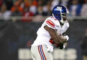 CHICAGO - AUGUST 22: Brandon Jacobs #27 of the New York Giants runs against the Chicago Bears during a pre-season game on August 22, 2009 at Soldier Field in Chicago, Illinois. The Bears defeated the Giants 17-3. (Photo by Jonathan Daniel/Getty Images)