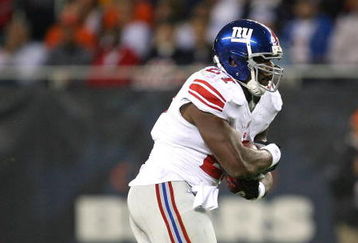 CHICAGO - AUGUST 22: Brandon Jacobs #27 of the New York Giants runs against the Chicago Bears during a pre-season game on August 22, 2009 at Soldier Field in Chicago, Illinois. The Bears defeated the Giants 17-3. (Photo by Jonathan Daniel/Getty Images)