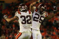 MIAMI - JANUARY 01: Darren Evans #32 celabrates his fourth quarter touch down with Josh Oglesby #25  of the Virginia Tech Hokies against the Cincinnati Bearcats during the FedEx Orange Bowl at Dolphin Stadium on January 1, 2009 in Miami, Florida.  (Photo by Marc Serota/Getty Images)