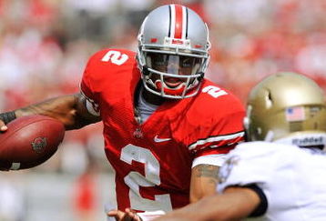 COLUMBUS, OH - SEPTEMBER 05:  Quarterback Terrelle Pryor #2 of the Ohio State Buckeyes tries to elude the tackle of Blake Carter #1 of the Navy Midshipmen at Ohio Stadium on September 5, 2009 in Columbus, Ohio.  Pryor ran for one touchdown and threw for one touchdown as Ohio State narrowly defeated Navy 31-27. (Photo by Jamie Sabau/Getty Images)