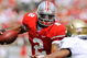 COLUMBUS, OH - SEPTEMBER 05: Quarterback Terrelle Pryor #2 of the Ohio State Buckeyes tries to elude the tackle of Blake Carter #1 of the Navy Midshipmen at Ohio Stadium on September 5, 2009 in Columbus, Ohio. Pryor ran for one touchdown and threw for one touchdown as Ohio State narrowly defeated Navy 31-27. (Photo by Jamie Sabau/Getty Images)