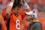 DENVER - AUGUST 30:  Head coach Josh McDaniels of the Denver Broncos talks with quarterback Kyle Orton #8 on the sidelines as they face the Chicago Bears during preseason NFL action at INVESCO Field at Mile High on August 30, 2009 in Denver, Colorado. The Bears defeated the Broncos 27-17.  (Photo by Doug Pensinger/Getty Images)