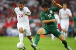 LONDON, ENGLAND - SEPTEMBER 05:  Aaron Lennon (L) of England holds off the challenge of Bojan Jokic (R) of Slovenia during the International Friendly match between England and Slovenia at Wembley Stadium on September 5, 2009 in London, England.  (Photo by Jamie McDonald/Getty Images)