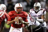 RALEIGH, NC - SEPTEMBER 3:  Quarterback Russell Wilson #16 of the North Carolina State Wolfpack drops back to pass with protection by Jeraill McCuller #50 against the South Carolina Gamecocks during the game at Carter-Finley Stadium on September 3, 2009 in Raleigh, North Carolina. (Photo by Streeter Lecka/Getty Images)