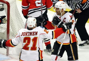 CHICAGO - APRIL 18:  Jarome Iginla #12 (R) and Olli Jokinen #21 of the Calgary Flames celebrate after Iginla scored a power play goal in the first period against the Chicago Blackhawks during Game Two of the Western Conference Quarterfinals of the 2009 Stanley Cup Playoffs on April 18, 2009 at the United Center in Chicago, Illinois.  (Photo by Jonathan Daniel/Getty Images)