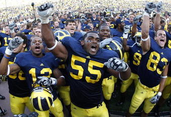 ANN ARBOR, MI - SEPTEMBER 05:  Brandon Graham #55 of the Michigan Wolverines leads his teammates in singing the schools fight song after beating the Western Michigan Broncos 31-7 on September 5, 2009 at Michigan Stadium in Ann Arbor, Michigan.  (Photo by Gregory Shamus/Getty Images)