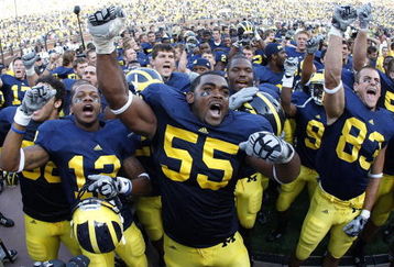 ANN ARBOR, MI - SEPTEMBER 05:  Brandon Graham #55 of the Michigan Wolverines leads his teammates in singing the schools fight song after beating the Western Michigan Broncos 31-7 on September 5, 2009 at Michigan Stadium in Ann Arbor, Michigan.  (Photo by Gregory Shamus/Getty Images)