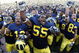 ANN ARBOR, MI - SEPTEMBER 05: Brandon Graham #55 of the Michigan Wolverines leads his teammates in singing the schools fight song after beating the Western Michigan Broncos 31-7 on September 5, 2009 at Michigan Stadium in Ann Arbor, Michigan. (Photo by Gregory Shamus/Getty Images)