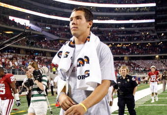 ARLINGTON, TX - SEPTEMBER 05:  Quarterback Sam Bradford #14 of the Oklahoma Sooners walks off the field after a 14-13 loss against the Brigham Young Cougars at Cowboys Stadium on September 5, 2009 in Arlington, Texas.  Bradford suffered an injury in the second quarter and did not return to the game.  (Photo by Ronald Martinez/Getty Images)