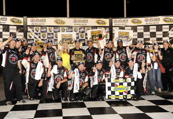 HAMPTON, GA - SEPTEMBER 05:  Kevin Harvick, driver of the #33 Jimmy John's Chevrolet, celebrates in victory lane with his crew after winning the NASCAR Nationwide Series Degree V12 300 at Atlanta Motor Speedway on September 5, 2009 in Hampton, Georgia.  (Photo by John Harrelson/Getty Images for NASCAR)