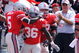 COLUMBUS, OH - SEPTEMBER 05:  Ohio State Buckeyes players congratulate Brian Rolle #36 of the Buckeyes after Rolle intercepted a Navy Midshipmen two-point conversion attempt and returned it 100 yards to the Navy endzone at Ohio Stadium on September 5, 2009 in Columbus, Ohio. Ohio State was granted the two points and held off Navy 31-27.  (Photo by Jamie Sabau/Getty Images)