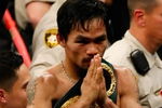 LAS VEGAS - MAY 02:  Manny Pacquiao of the Philippines celebrates after knocking out Ricky Hatton of England in the second round during their junior welterweight title fight at the MGM Grand Garden Arena May 2, 2009 in Las Vegas, Nevada.  (Photo by Ethan Miller/Getty Images)