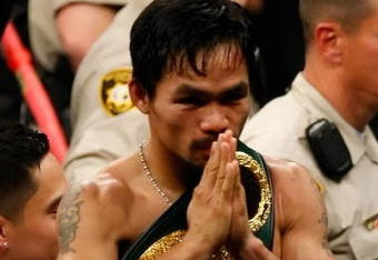 LAS VEGAS - MAY 02:  Manny Pacquiao of the Philippines celebrates after knocking out Ricky Hatton of England in the second round during their junior welterweight title fight at the MGM Grand Garden Arena May 2, 2009 in Las Vegas, Nevada.  (Photo by Ethan Miller/Getty Images)