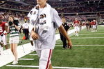 ARLINGTON, TX - SEPTEMBER 05:  Quarterback Sam Bradford #14 of the Oklahoma Sooners walks off the field after a 14-13 loss against the Brigham Young Cougars at Cowboys Stadium on September 5, 2009 in Arlington, Texas.  Bradford suffered an injury in the second quarter and did not return to the game.  (Photo by Ronald Martinez/Getty Images)