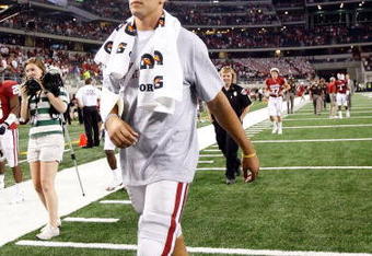 ARLINGTON, TX - SEPTEMBER 05:  Quarterback Sam Bradford #14 of the Oklahoma Sooners walks off the field after a 14-13 loss against the Brigham Young Cougars at Cowboys Stadium on September 5, 2009 in Arlington, Texas.  Bradford suffered an injury in the second quarter and did not return to the game.  (Photo by Ronald Martinez/Getty Images)