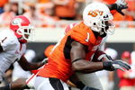 STILLWATER, OK - SEPTEMBER 5:  Wide receiver Dez Bryant #1 of the Oklahoma State Cowboys carries for an 18-yard return during the second quarter of the game against the Georgia Bulldogs at Boone Pickens Stadium on September 5, 2009 in Stillwater, Oklahoma. (Photo by Christian Petersen/Getty Images)