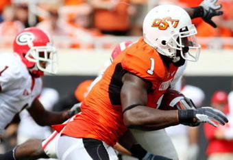 STILLWATER, OK - SEPTEMBER 5:  Wide receiver Dez Bryant #1 of the Oklahoma State Cowboys carries for an 18-yard return during the second quarter of the game against the Georgia Bulldogs at Boone Pickens Stadium on September 5, 2009 in Stillwater, Oklahoma. (Photo by Christian Petersen/Getty Images)
