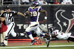 HOUSTON - AUGUST 31:  Running back Adrian Peterson #28 scores on a 75 yard run as strong safety Dominique Barber #34 of the Houston Texans makes a diving attempt to make the tackle at Reliant Stadium on August 31, 2009 in Houston, Texas.  (Photo by Bob Levey/Getty Images)
