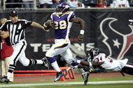 HOUSTON - AUGUST 31:  Running back Adrian Peterson #28 scores on a 75 yard run as strong safety Dominique Barber #34 of the Houston Texans makes a diving attempt to make the tackle at Reliant Stadium on August 31, 2009 in Houston, Texas.  (Photo by Bob Levey/Getty Images)