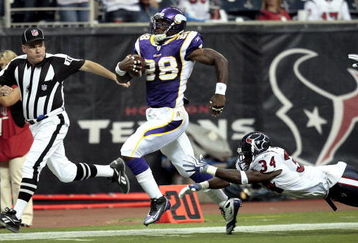 HOUSTON - AUGUST 31:  Running back Adrian Peterson #28 scores on a 75 yard run as strong safety Dominique Barber #34 of the Houston Texans makes a diving attempt to make the tackle at Reliant Stadium on August 31, 2009 in Houston, Texas.  (Photo by Bob Levey/Getty Images)