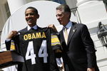WASHINGTON  - MAY 21:  U.S. President Barack Obama (L) holds up a jersey as Pittsburgh Steelers as President Art Rooney II (3rd R), looks on at the South Portico of White House May 21, 2009 in Washington, DC. The Steelers deafeated the Arizona Cardinals in Super Bowl XLIII.   (Photo by Aude Guerrucci-Pool/Getty Images)