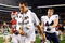 ARLINGTON, TX - SEPTEMBER 05:  Quarterback Sam Bradford #14 of the Oklahoma Sooners walks off the field past Jeremy Beal #44 after a 14-13 loss against the Brigham Young Cougars at Cowboys Stadium on September 5, 2009 in Arlington, Texas.  Bradford suffered an injury in the second quarter and did not return to the game.  (Photo by Ronald Martinez/Getty Images)