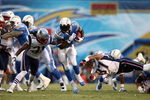 SAN DIEGO - OCTOBER 12:  Runningback LaDainian Tomlinson #21 of the San Diego Chargers runs against the defense of the New England Patriots during the first half of their NFL Game on October 12, 2008 at Qualcomm Stadium in San Diego, California.  (Photo by Donald Miralle/Getty Images)