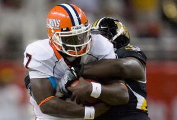 ST. LOUIS, MO - AUGUST 30: Juice Williams #7 of the University of Illinois Fighting Illini is sacked against the University of Missouri Tigers during the State Farm Arch Rivalry game at the Edward Jones Dome on August 30, 2008 in St. Louis, Missouri.  The Tigers beat the Fighting Illini 52-42.  (Photo by Dilip Vishwanat/Getty Images)