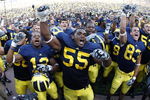 ANN ARBOR, MI - SEPTEMBER 05:  Brandon Graham #55 of the Michigan Wolverines leads his teammates in singing the schools fight song after beating the Western Michigan Broncos 31-7 on September 5, 2009 at Michigan Stadium in Ann Arbor, Michigan.  (Photo by Gregory Shamus/Getty Images)