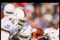 1 Jan 1991:  Running back Adrian Walker of the Texas Longhorns is tackled during the Cotton Bowl against the Miami Hurricanes at the Cotton Bowl in Dallas, Texas.  Miami won the game 46-3. Mandatory Credit: Joe Patronite  /Allsport