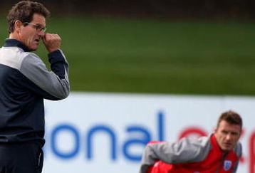 ST ALBANS, ENGLAND - SEPTEMBER 01:  Fabio Capello Manager of England is whatched by David Beckham as he takes England training at London Colney on September 1, 2009 in St Albans, England.  (Photo by Phil Cole/Getty Images)