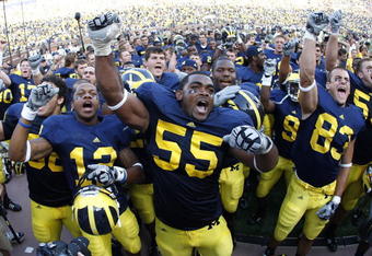 ANN ARBOR, MI - SEPTEMBER 05:  Brandon Graham #55 of the Michigan Wolverines leads his teammates in singing the schools fight song after beating the Western Michigan Broncos 31-7 on September 5, 2009 at Michigan Stadium in Ann Arbor, Michigan.  (Photo by Gregory Shamus/Getty Images)