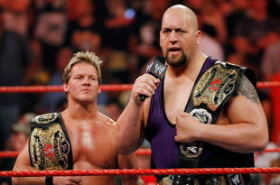 LAS VEGAS - AUGUST 24:  Wrestlers and tag team partners Chris Jericho (L) and Big Show appear in the ring during the WWE Monday Night Raw show at the Thomas & Mack Center August 24, 2009 in Las Vegas, Nevada.  (Photo by Ethan Miller/Getty Images)
