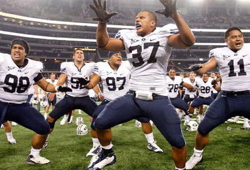 ARLINGTON, TX - SEPTEMBER 05:  (L-R) Romney Fuga #98, Vic So'oto #37 and Manase Tonga #11 of the Brigham Young Cougars celebrate a 14-13 win against the Oklahoma Sooners at Cowboys Stadium on September 5, 2009 in Arlington, Texas.  (Photo by Ronald Martinez/Getty Images)