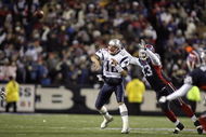 BUFFALO, NY - NOVEMBER 18: Tom Brady #12 of the New England Patriots passes underpresure by Anthony Hargrove #93 of the Buffalo Bills at Ralph Wilson Stadium November 18, 2007 in Orchard Park, New York. (Photo by Rick Stewart/Getty Images)