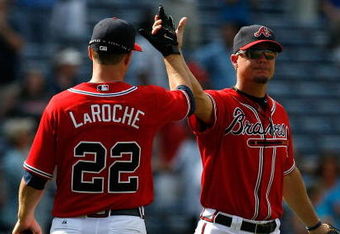 ATLANTA - AUGUST 23:  Chipper Jones #10 and Adam LaRoche #22 of the Atlanta Braves celebrate their 7-5 win over the Florida Marlins on August 23, 2009 at Turner Field in Atlanta, Georgia.  (Photo by Kevin C. Cox/Getty Images)