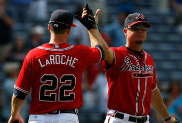 ATLANTA - AUGUST 23:  Chipper Jones #10 and Adam LaRoche #22 of the Atlanta Braves celebrate their 7-5 win over the Florida Marlins on August 23, 2009 at Turner Field in Atlanta, Georgia.  (Photo by Kevin C. Cox/Getty Images)