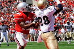 COLUMBUS, OH - SEPTEMBER 05:  Marcus Curry #28 of the Navy Midshipmen catches a touchdown pass in front of Anderson Russell #21 of the Ohio State Buckeyes at Ohio Stadium on September 5, 2009 in Columbus, Ohio. Curry had two touchdown catches in Navy's 31-27 loss to Ohio State.  (Photo by Jamie Sabau/Getty Images)