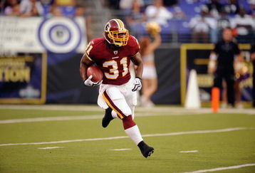 BALTIMORE, MD - AUGUST 13:  Rock Cartwright #31 of the Washington Redskins runs with the ball during a NFL preseason football game against the Baltimore Ravens on August 13, 2009 at M & T Bank Stadium in Baltimore, Maryland.   (Photo by Mitchell Layton/Getty Images)