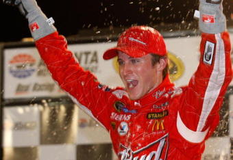 HAMPTON, GA - SEPTEMBER 06: Kasey Kahne, driver of the #9 Budweiser Dodge, celebrates winning the NASCAR Sprint Cup Series Pep Boys Auto 500 at Atlanta Motor Speedway on September 6, 2009 in Hampton, Georgia.  (Photo by Geoff Burke/Getty Images for NASCAR)