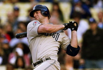LOS ANGELES - JUNE 10:  Kevin Kouzmanoff #5 of the San Diego Padres hits an infield single for an RBI in the first inning against the Los Angeles Dodgers on June 10, 2009 at Dodger Stadium in Los Angeles, California.  (Photo by Stephen Dunn/Getty Images)